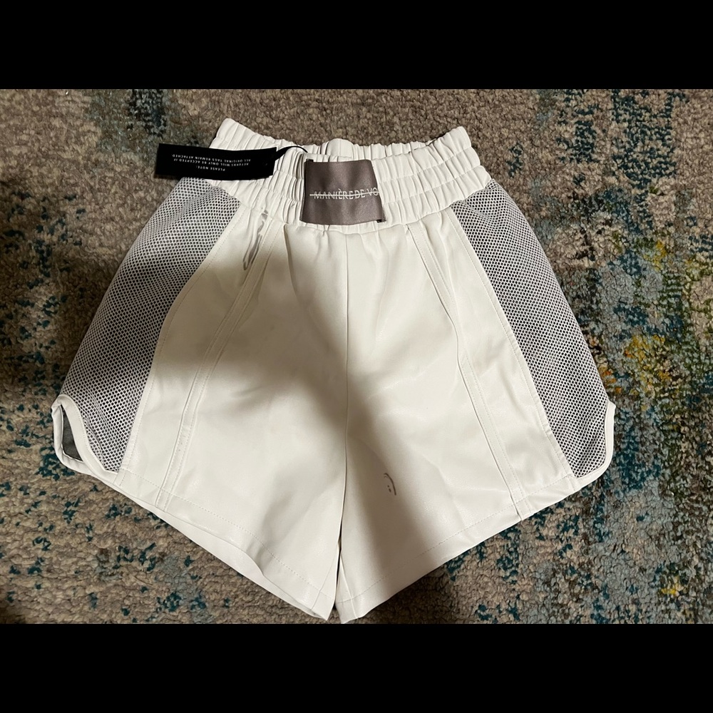 White leather shorts